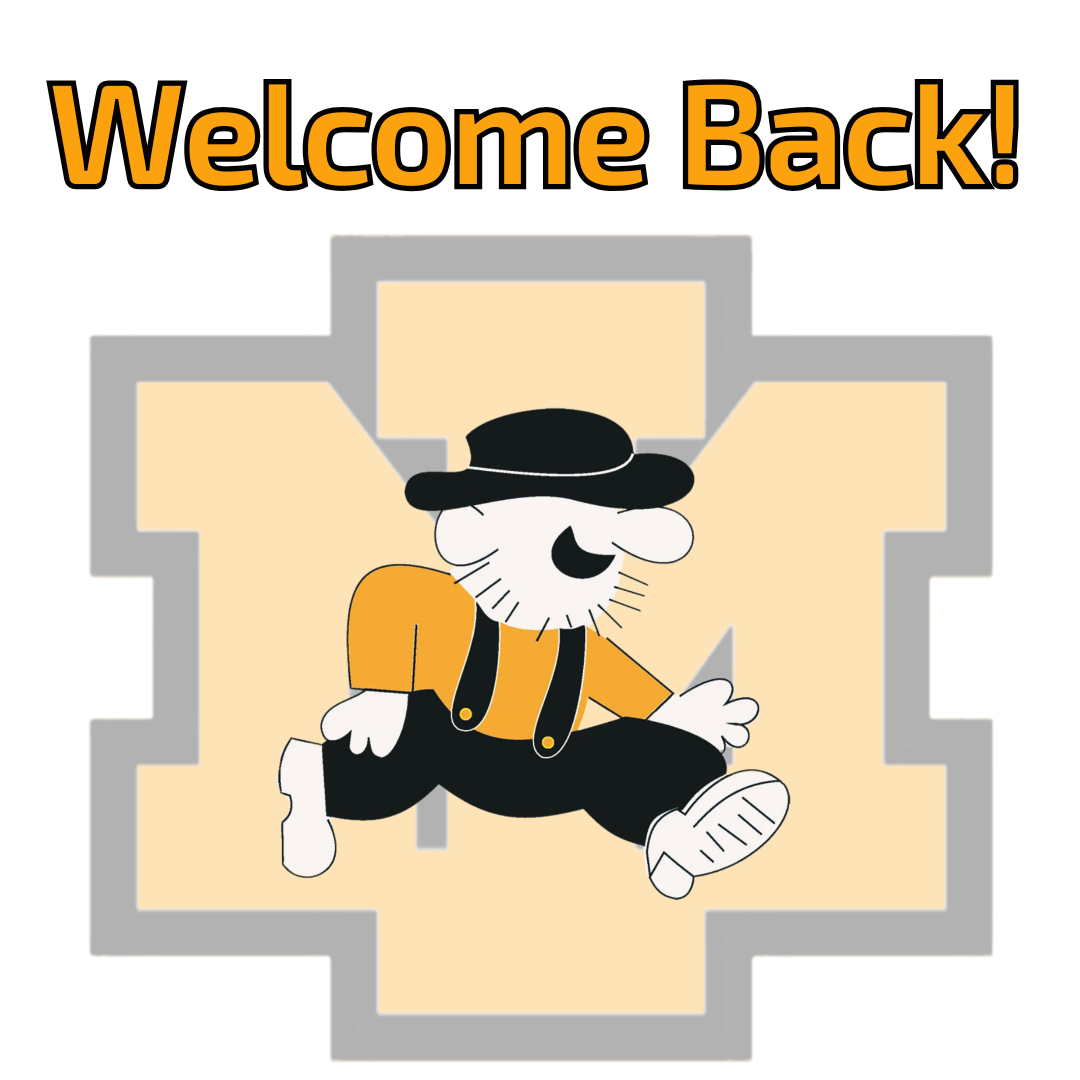 A "Welcome Back!" announcement graphic featuring the Iron Mountain Public Schools colors and mascot. At the top, the words "Welcome Back!" are written in bold orange font with a black outline. Centered below is a large, geometric "IM" logo in beige with a thick grey border. Overlaid on the logo is a cartoon mascot of a "Mountaineer"—a smiling man with a white beard, wearing a black wide-brimmed hat, an orange shirt, and black suspenders over black trousers, captured in a walking or marching pose.